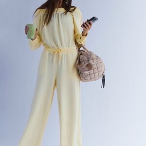 NWOT Free People One To Beat Onesie in sunlit yellow